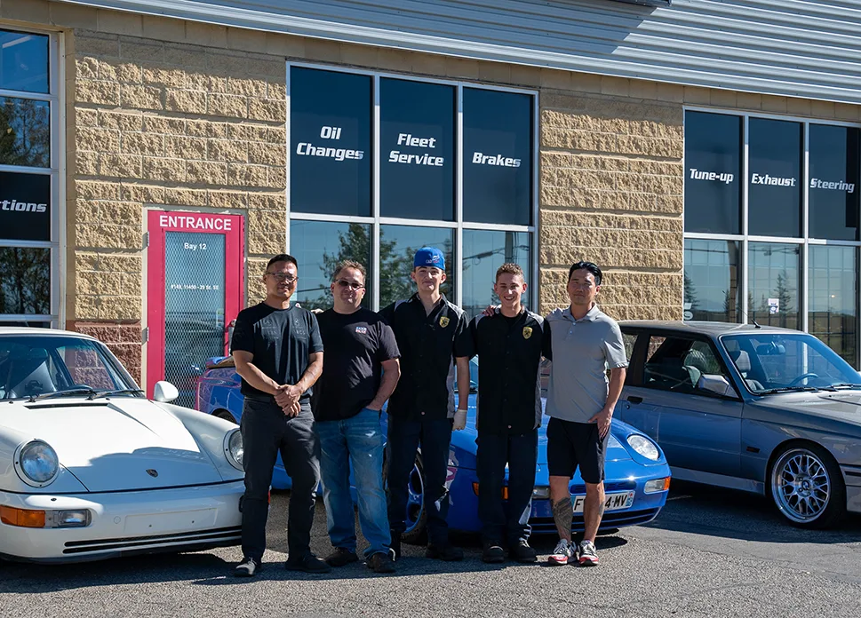 The EuroSpec team standing together outside the shop
